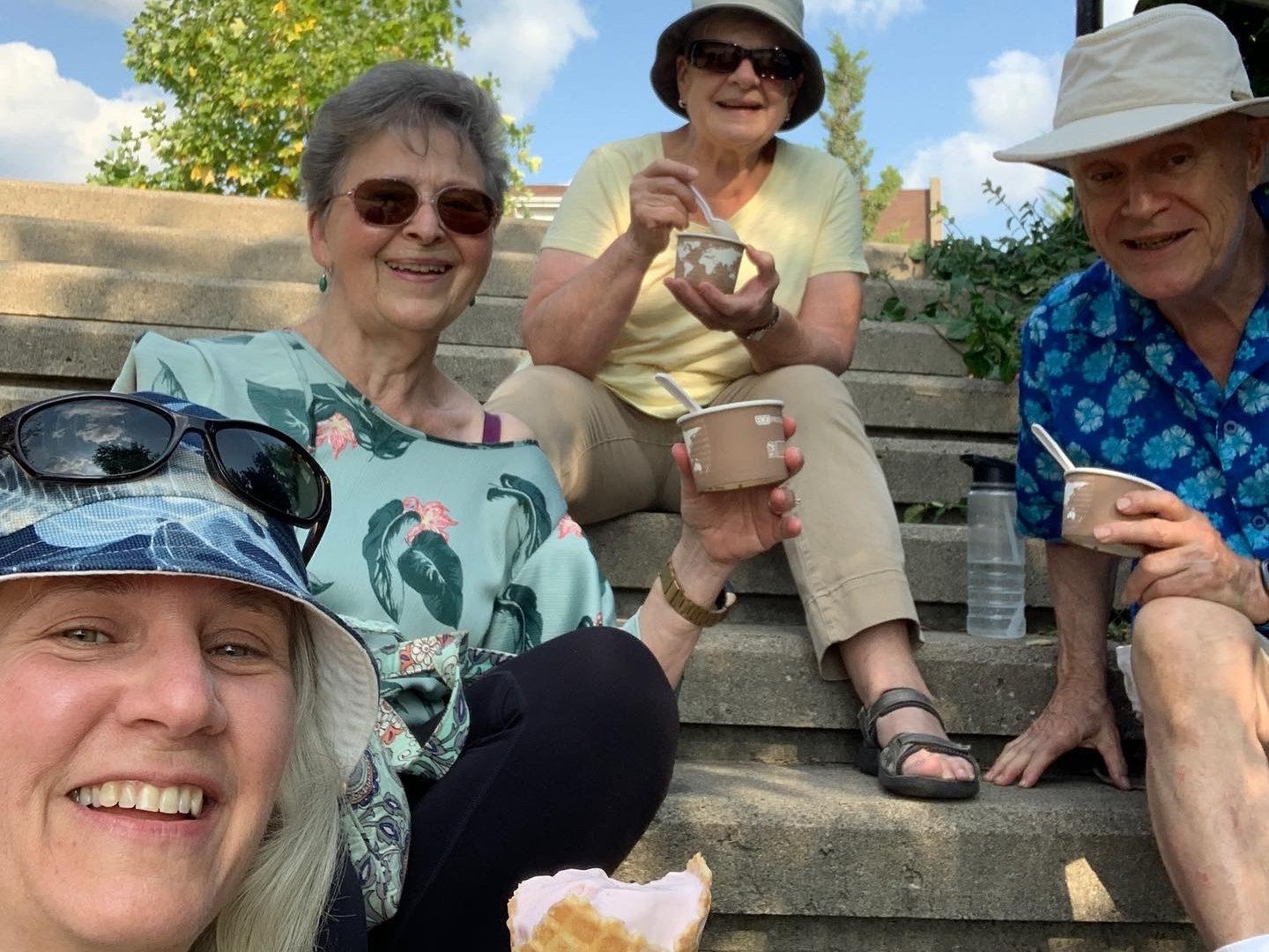 4 Stroll Walking Tour guests enjoying ice cream after a hot August afternoon tour in Cambridge. 