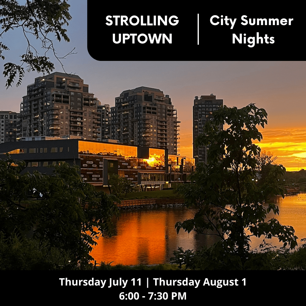 Golden Hour sunset reflects on buildings and Silver Lake in Waterloo Ontario
