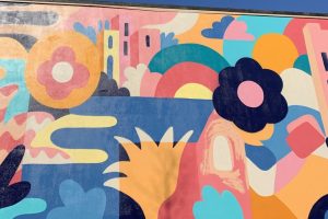 Multicolour mural in abstract shapes with blue sky above